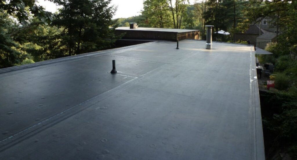 Commercial flat roof with black EPDM roofing membrane
